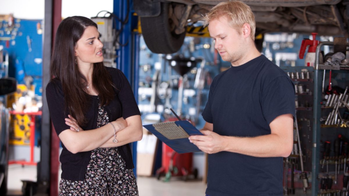 Service advisor reviewing vehicle information with a customer