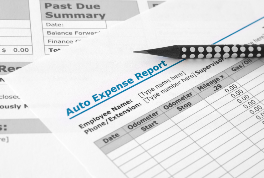 An auto service worker writes up and explains service charges for clients.