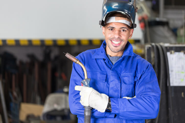 A student in auto mechanic school honing welding skills