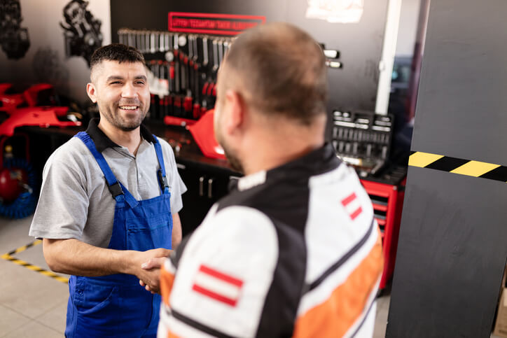 A hybrid and electric vehicle mechanic at an auto repair shop