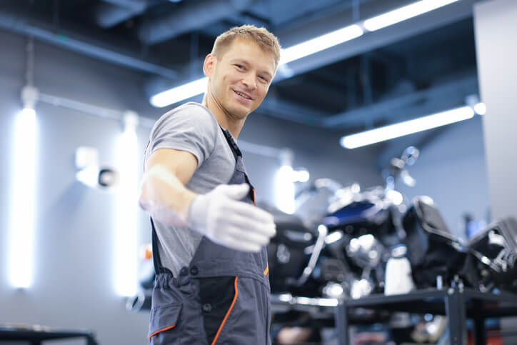 Auto Parts Training Graduate managing an auto parts shop