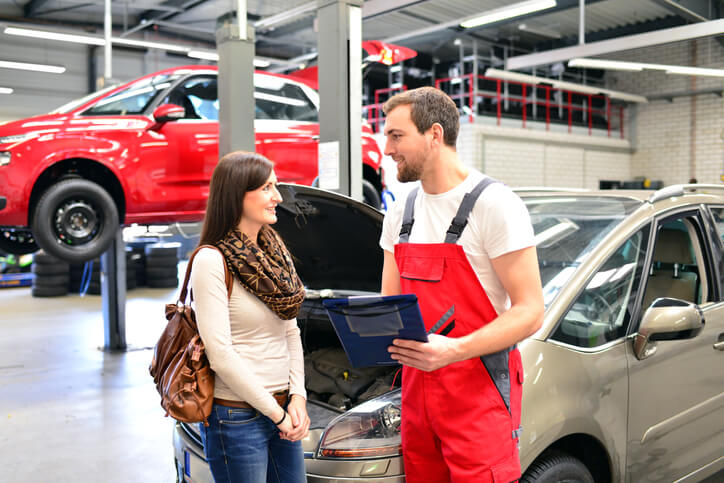 A student in auto mechanic school upselling services to a client