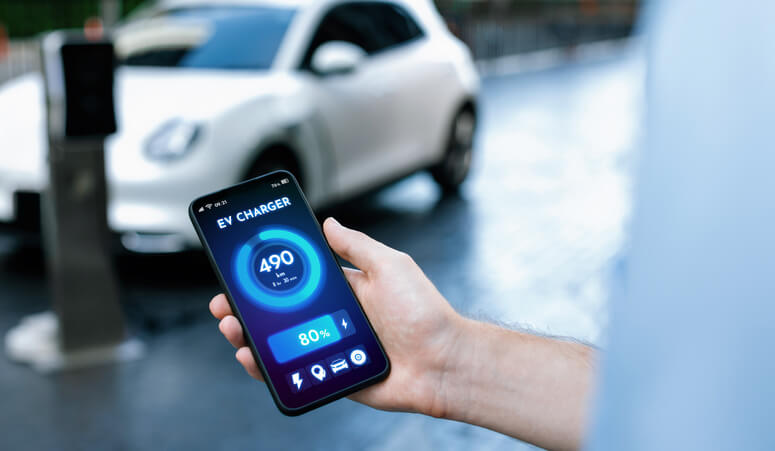 A mobile phone displaying EV battery status to be explored in automotive school