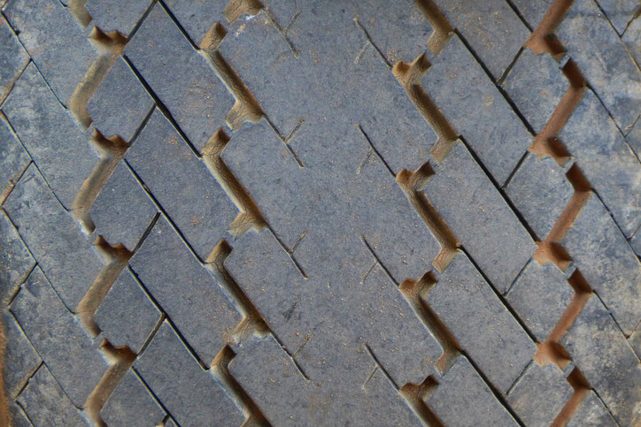 A close-up of the tread wear pattern on a passenger vehicle