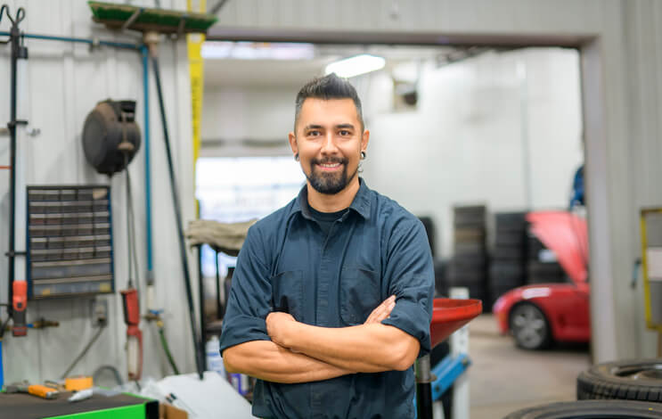Service manual beside engine parts in the training bay