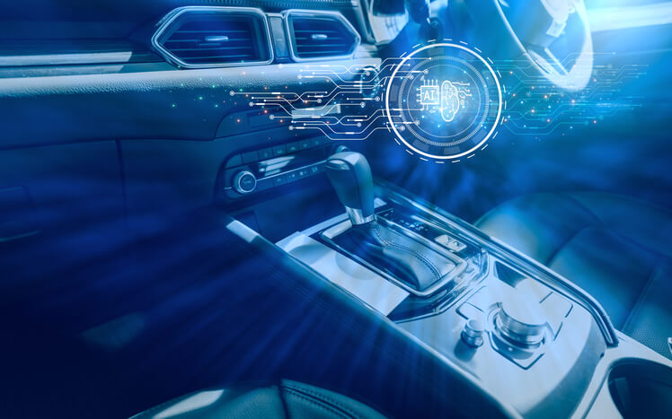 An auto mechanic using a diagnostic tool connected to vehicle software