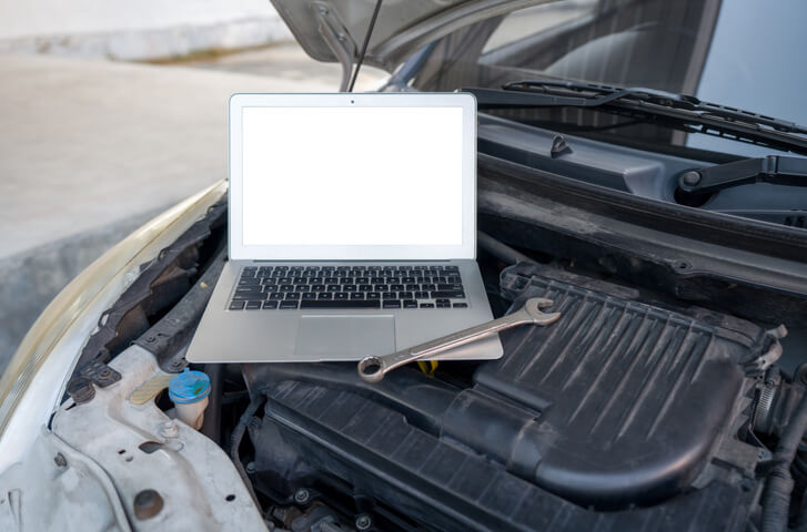 An instructor teaching software calibration in an automotive training class