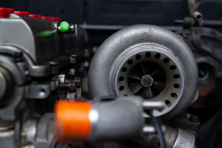A cross-section of a turbocharger showing turbine and compressor housings