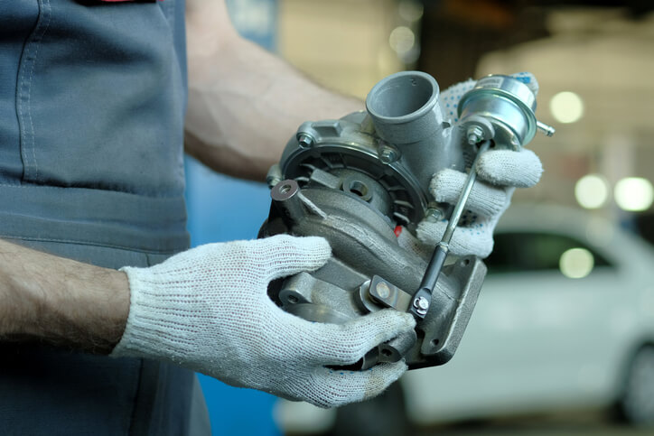 A close-up view of a turbocharger mounted on a high-performance engine