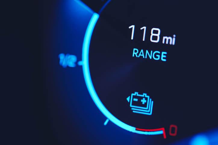 A dashboard of an electric vehicle showing reduced winter range