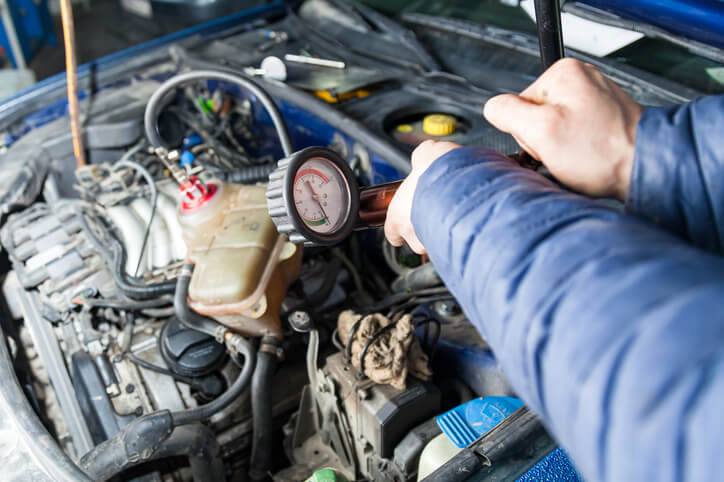 An instructor demonstrating radiator pressure testing at ATC Cambridge