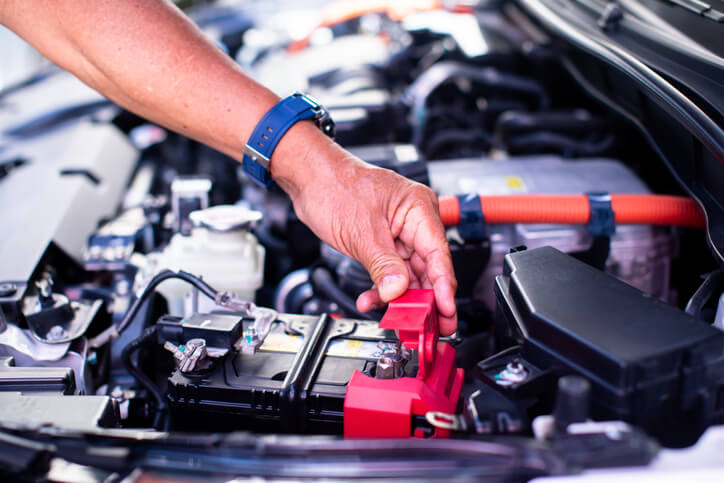 An electric vehicle mechanic preparing second-life EV batteries for the vehicle