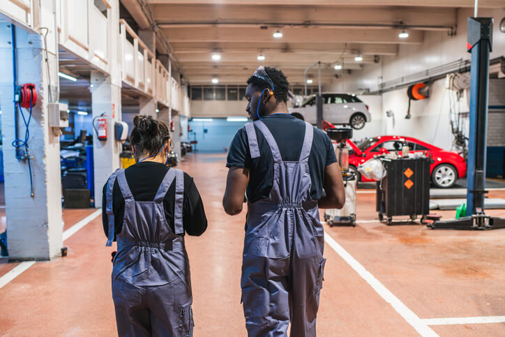 A pair of students during their hybrid vehicle automotive school training