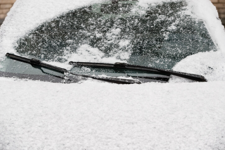 A student during automotive training in Montreal, replacing windshield wipers for winter prep