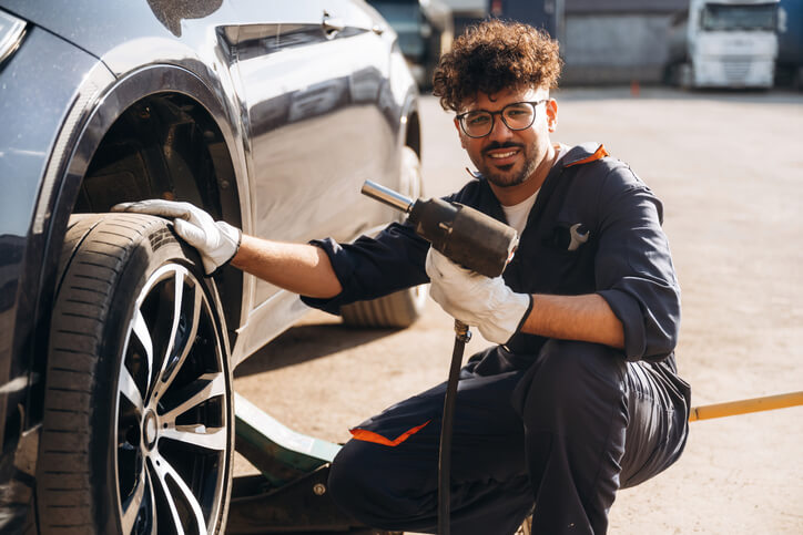 A student in the automotive service technicians and mechanics training performing tire service and diagnostics