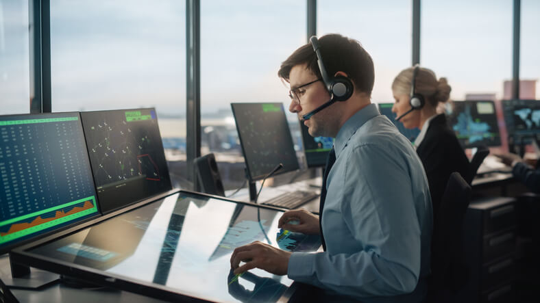 An automotive dispatcher coordinating transportation operations in a busy office