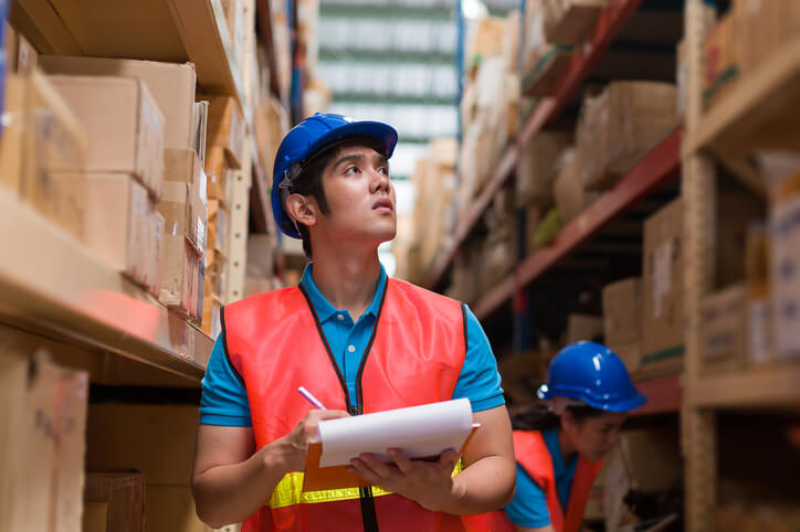 Auto parts professional organizing shelves during a shortage challenge