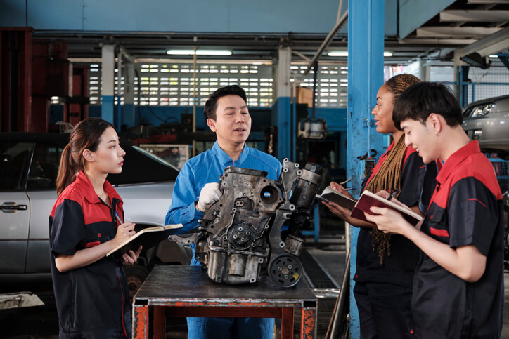ATC Surrey hands-on training with students practicing auto parts course skills
