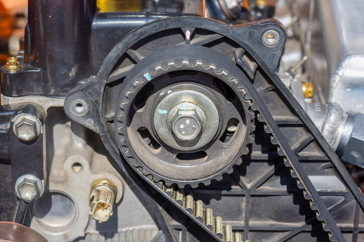 A student at ATC auto mechanic school in Surrey, instructor exploring camshaft timing alignment