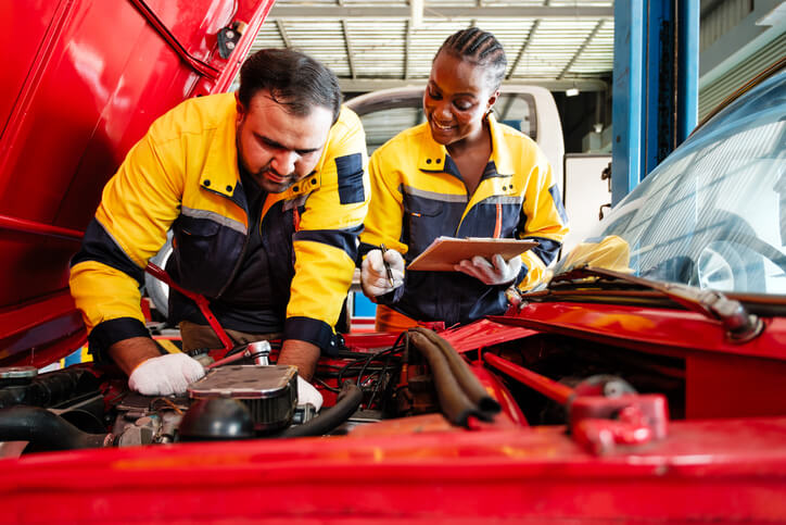 An automotive service technician program student learning professional repair skills during training