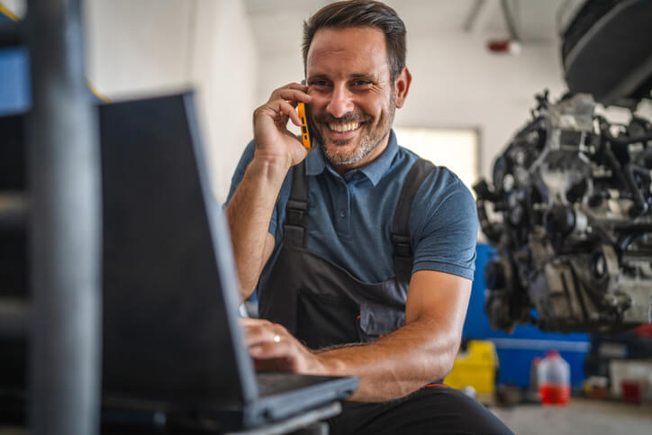 An instructor demonstrating multitasking and task prioritization in an automotive service technician program.
