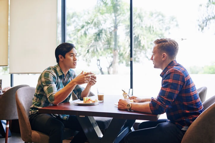 Students practicing interview questions together as part of preparation for an auto mechanic job interview.