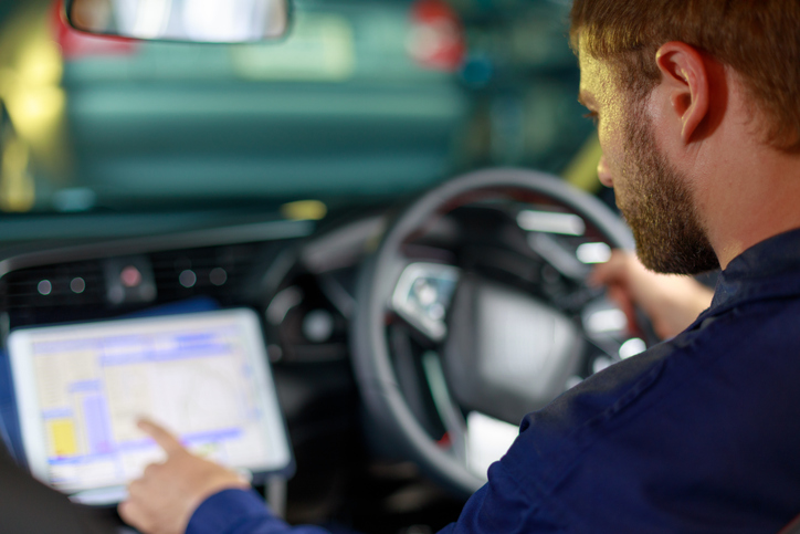 Independent automotive technician accessing digital diagnostic information.