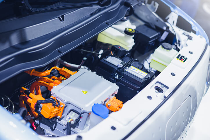 An electric car battery under the hood, as explored in EV battery recycling