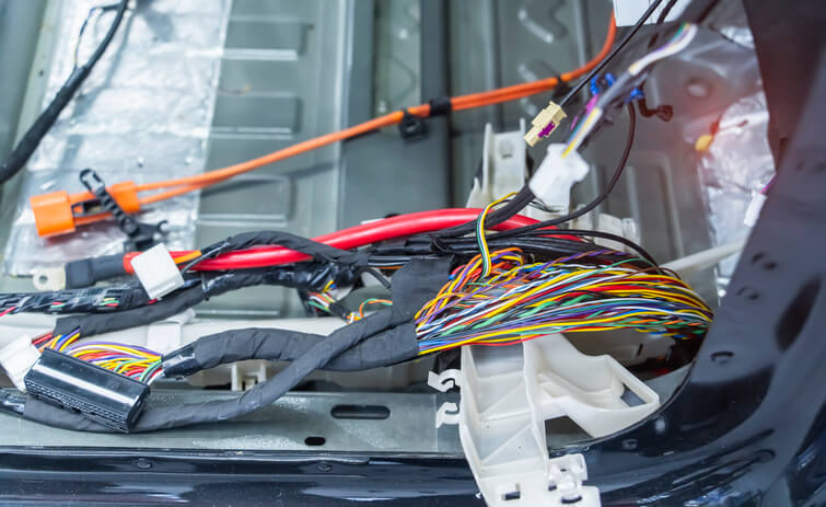 A close-up of automotive Ethernet wiring integrated into a modern vehicle network system