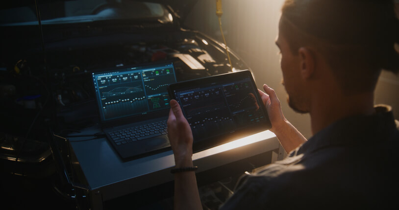 A mechanic analyzing live sensor data during automotive diagnostics