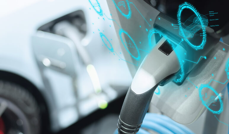 An electric vehicle plugged into a Level 2 charger in a residential garage