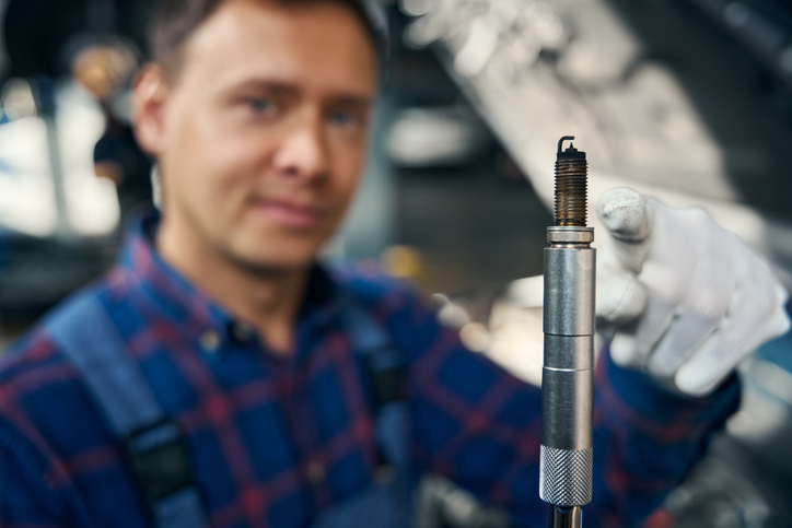 An automotive student learning about ignition timing and spark delivery systems