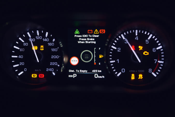 A vehicle dashboard displaying a lower gear selection used for engine braking