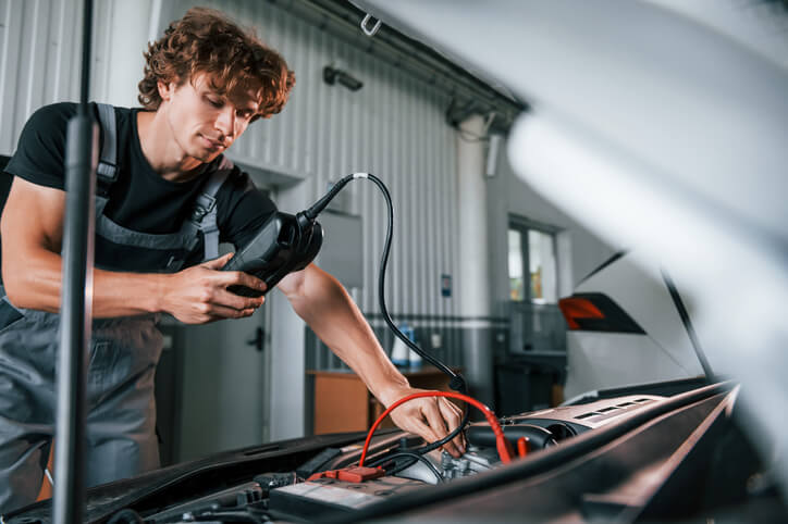 An automotive student learning forced induction system diagnostics