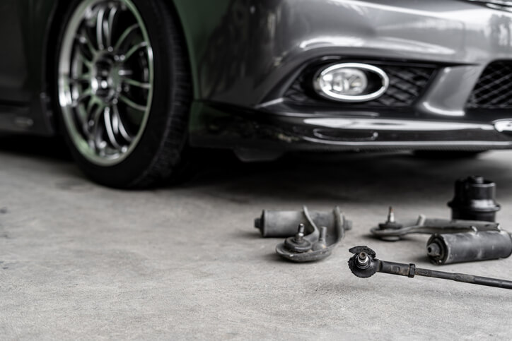 Close-up of an automotive ball joint connected to the steering and suspension system