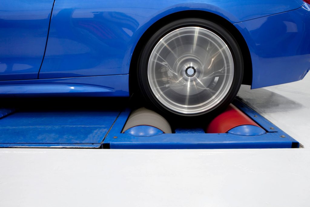 Vehicle secured on a dynamometer before performance testing