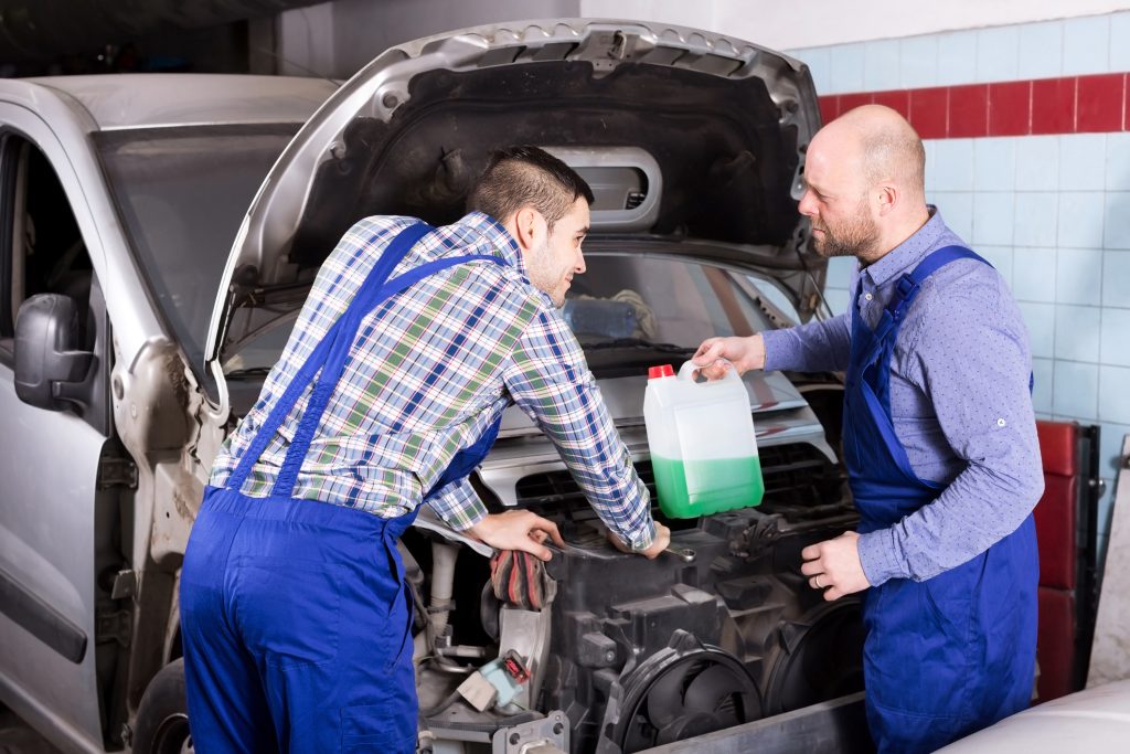 Instructor explaining coolant types during automotive school in Montreal