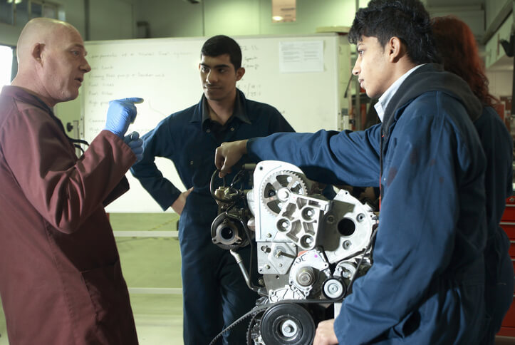Student learning hybrid transaxle maintenance in a Surrey automotive program