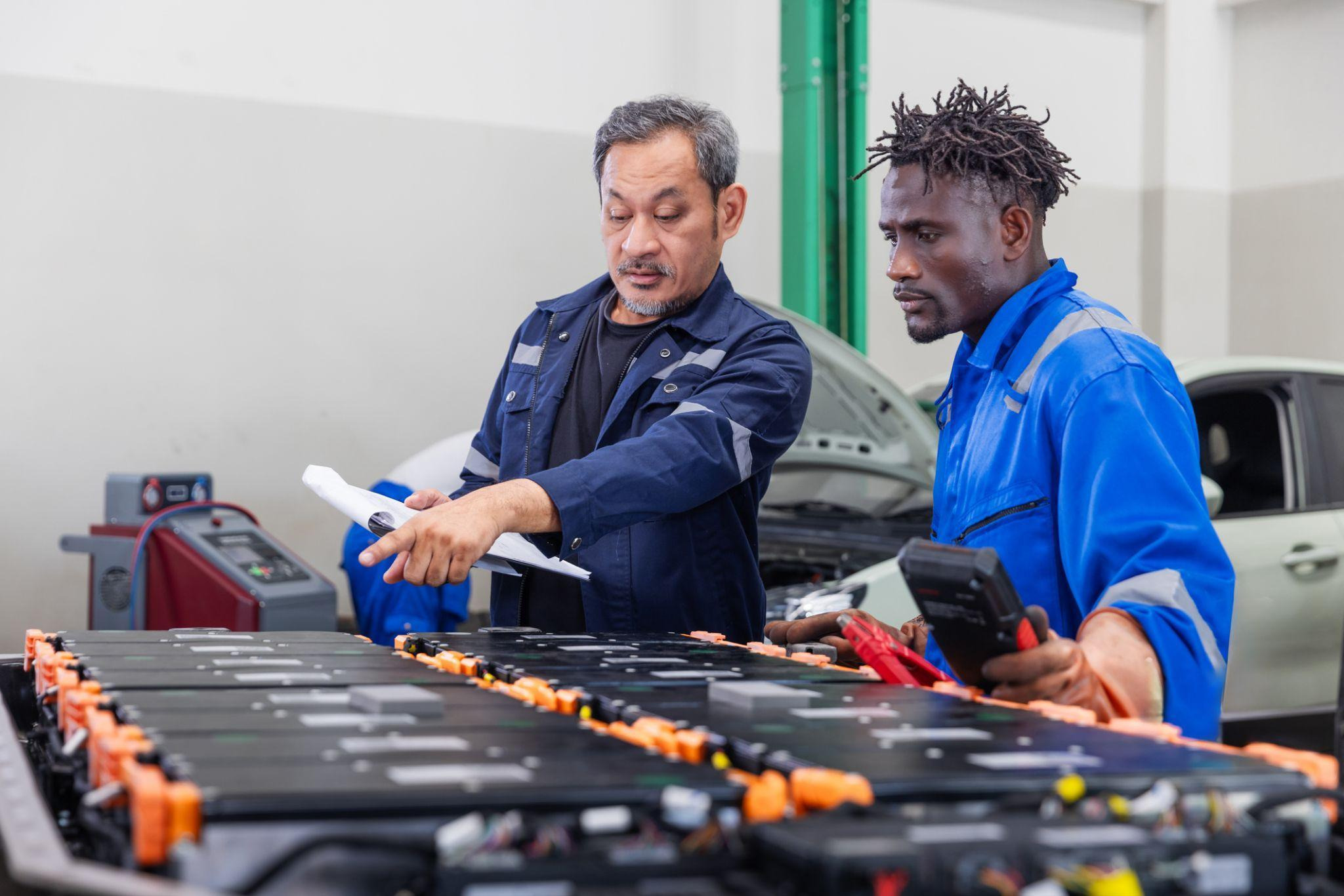 Student learning EV battery preconditioning during hybrid vehicle training