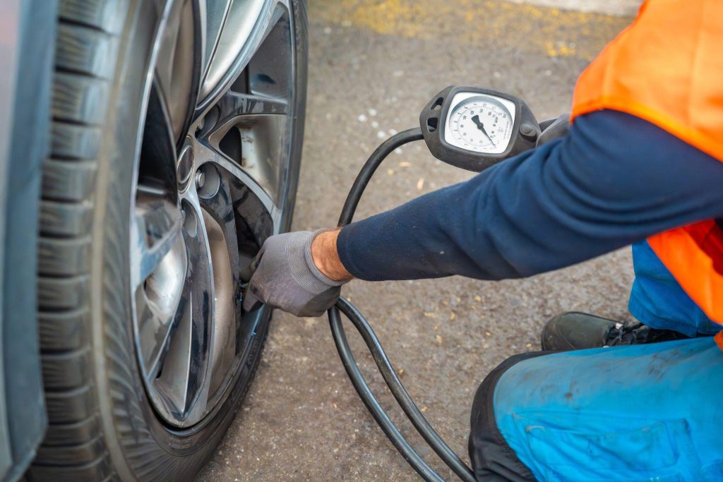 Technician checking a tire pressure monitoring system