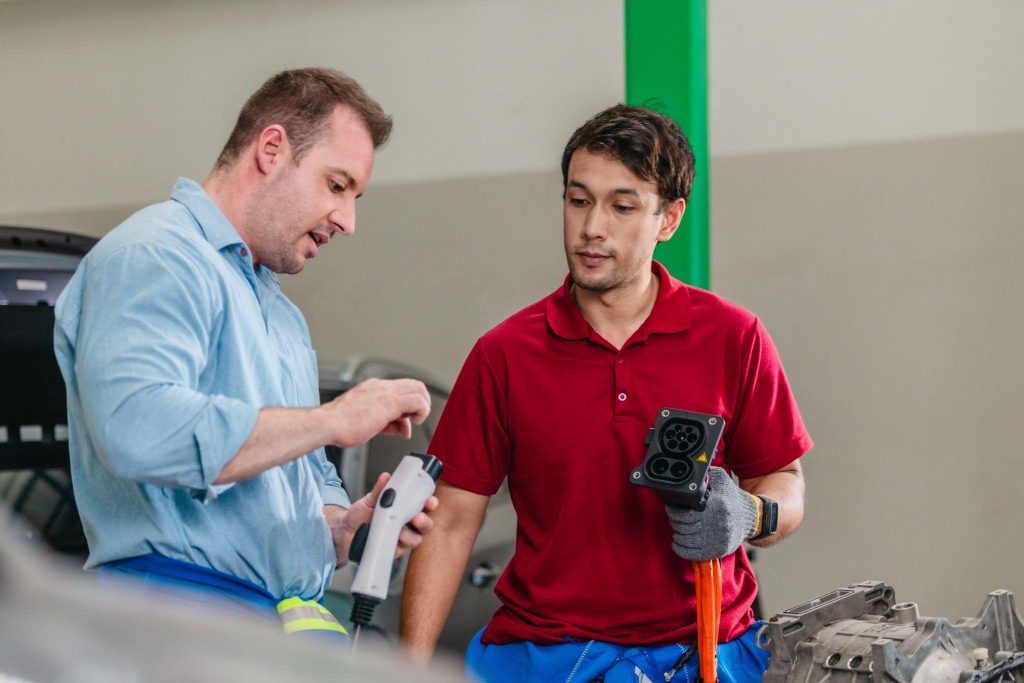 A future EV technician learning about Toyota bZ charging systems
