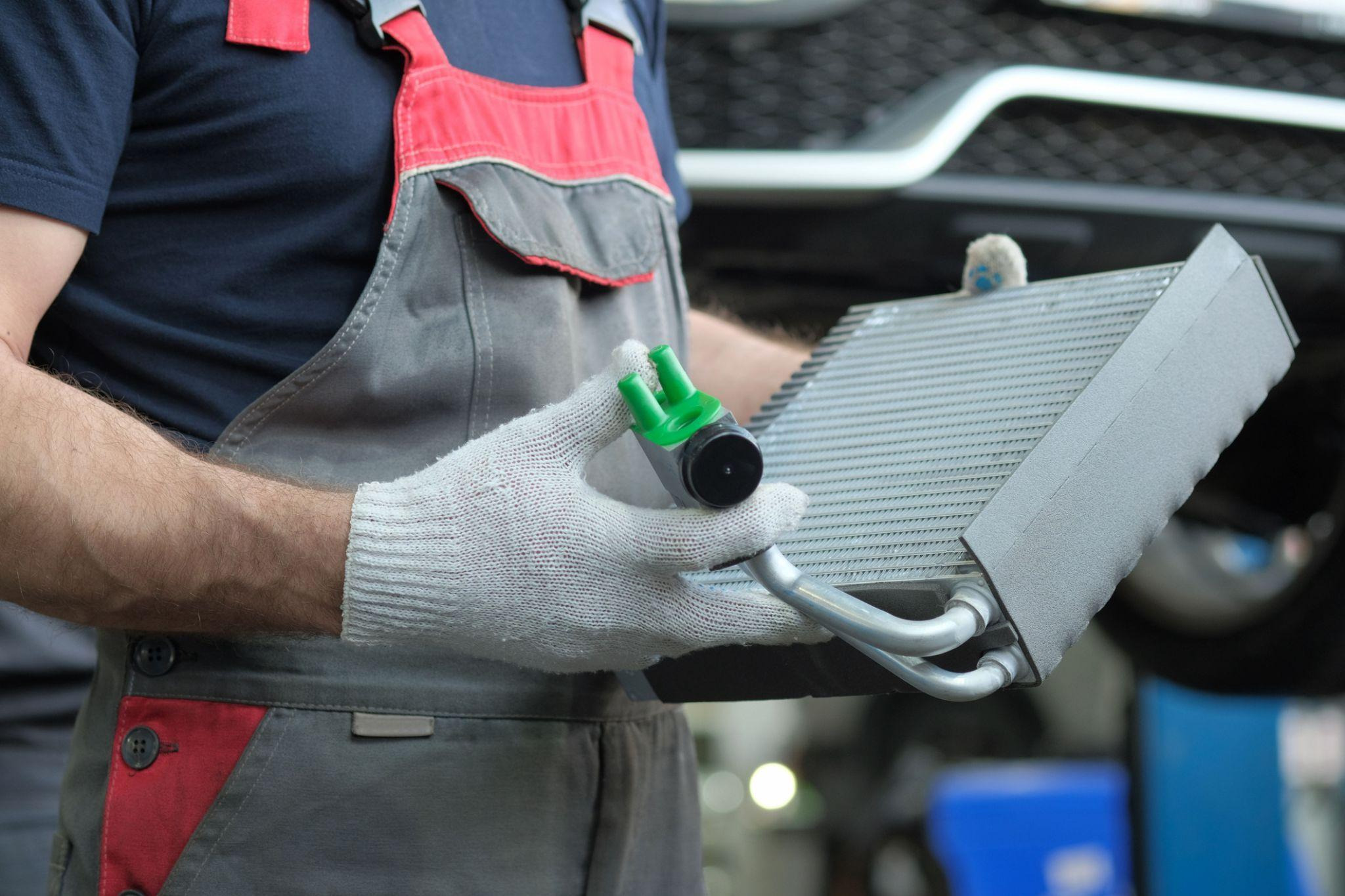 A technician investigating heater core symptoms in a vehicle
